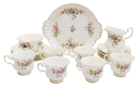 A Royal Albert porcelain Moss Rose pattern part tea service, comprising bread plate, cream jug, sugar bowl, six teacups, saucers and plates.