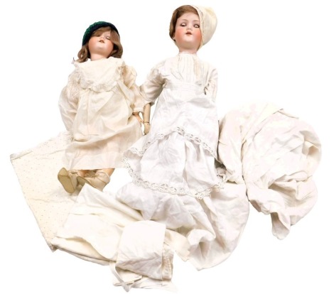 An Armand Marseilles bisque head doll, model 390, A8M, and a further doll A6½M, with linen and lace clothing. (2)