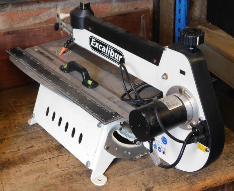 An Excalibur EX21 scroll saw, serial number 21847512, together with rulers and set squares, one with a spirit level set handle.