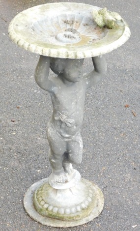 A lead birdbath, the circular bowl with a bird to the edge, raised on a putto support and circular base, 75cm high.