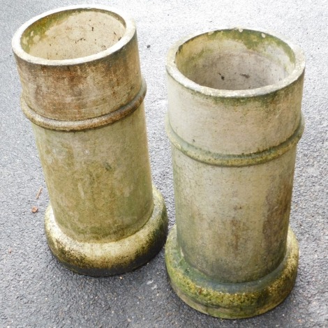 A pair of Victorian white stoneware chimney pots, of cylindrical form, 62cm high.