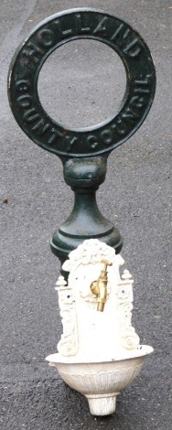 A mid century Holland County Council cast iron column sign, of circular form, painted green, 87cm high, together with a Victorian white painted cast iron garden font, 37cm high. (2)