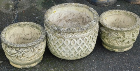 A Sheerston Earl concrete planter, with Celtic knot decoration, 32cm high, and a pair of garden pots, with leaf moulded decoration, 23cm high. (3)