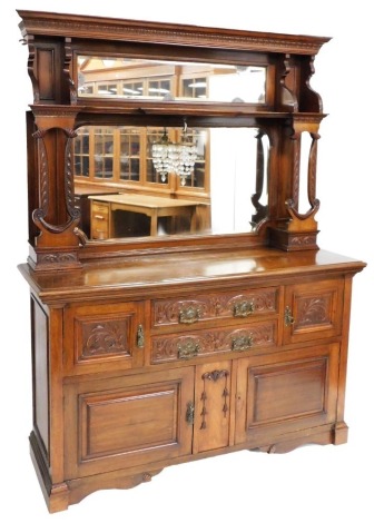 A Victorian mahogany sideboard, with foliate carved out swept pediment, above a rectangular mirrored plate, and shaped shelf, raised on lyre supports, with a further bevelled glass plate, the base with two central drawers, flanked by cupboard doors, flora