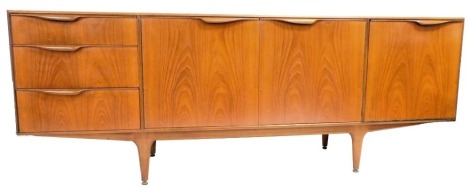 An A H McIntosh and Company Limited teak sideboard, with two central doors, flanked by a door to the right and three graduated drawers to the left, raised on turned legs, brass capped, 76cm high, 201cm wide, 48cm deep.