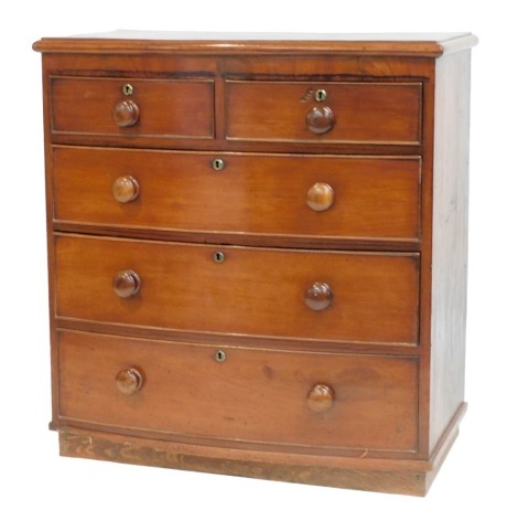 A Victorian mahogany bow front chest, of two short over three long graduated drawers, raised on a block base, 100cm high, 94cm wide, 52cm deep.