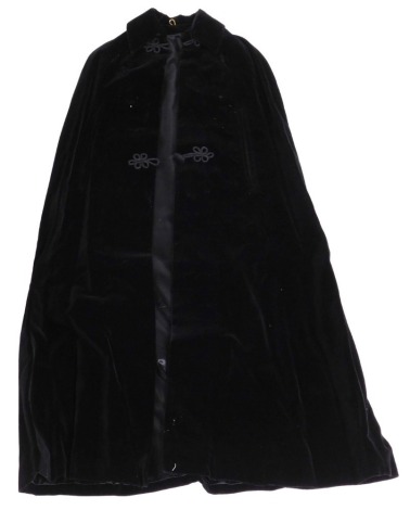 A mid century Raymond of London black velvet evening cape.