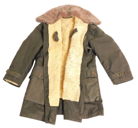 A Mats Larsson Swedish army field coat, M1909, with a sheepskin lining.