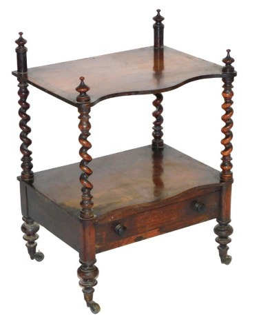 A Victorian rosewood whatnot, of serpentine form, the top, lacking gallery, above a further shelf and frieze drawer, raised on turned legs, brass capped on castors, 70cm high, 51cm wide, 37cm deep.