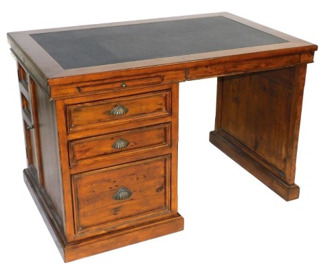 A Victorian style hardwood desk, the top inset with black leather, above a slide and drop front drawer, a single pedestal with two drawers and a filing drawer, raised on a plinth space, 82cm x 125cm x 79cm.