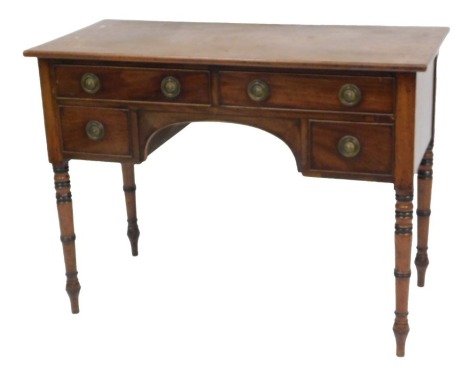 A Georgian mahogany dressing table, with two long above two short drawers, raised on turned legs, 77cm high, 102cm wide, 47cm deep.