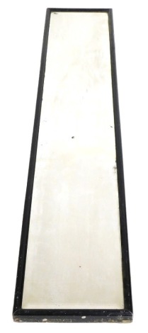 An early 20thC ebonised tack room mirror, inset bevelled glass, 190cm x 34cm.