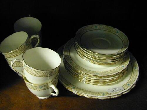 A bone china Tea Service printed with scale and medallion borders