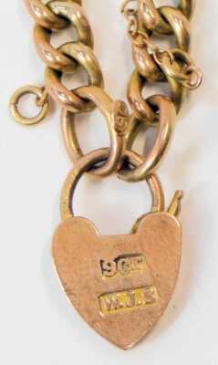 A rose gold child's curb link bracelet, on a heart shaped padlock clasp, stamped 9ct, 2.4g. - 2