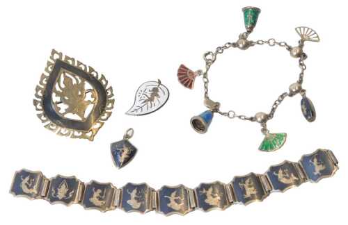 A Siamese silver and niello brooch, a nine-link silver and niello bracelet, on a snap clasp, a pair of silver and enamel leaf shaped earrings, and a silver and enamel charm bracelet.