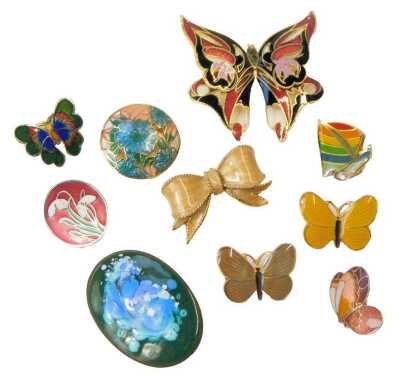 A group of enamel brooches, including butterflies, rainbow, yacht, and a tied bow. (a quantity)