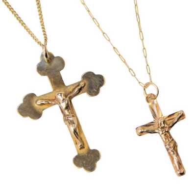 A 9ct gold crucifix pendant, on a fine curb link neck chain, and a further crucifix pendant on chain, 3.6g.