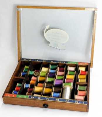 A 20thC oak Gillette display case, with a hinged top, with various compartments for different sized blades, containing reels of thread, 38.5cm wide. - 2