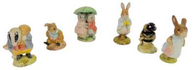 A group of Royal Albert Beatrix Potter figures, comprising Tommy Brock, Peter with Daffodils, Babbitty Bumble, Mrs Flopsy Bunny, Goody and Timmy Tiptoes and Old Mr Bouncer.