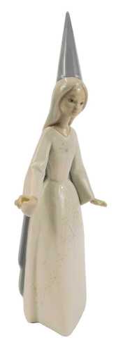 A Lladro porcelain figure, modelled as Fairy Godmother, printed marks, 28cm high, boxed.