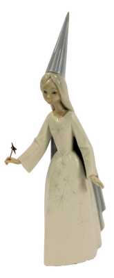 A Lladro porcelain figure, modelled as Fairy Godmother with wand, printed marks, 27cm high.