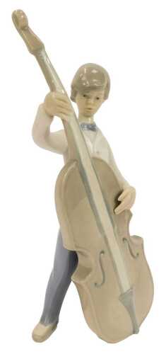 A Lladro porcelain figure, modelled as a boy playing a cello, printed marks, 25cm high.