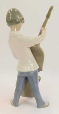 A Lladro porcelain figure, modelled as a boy playing a cello, printed marks, 25cm high. - 2