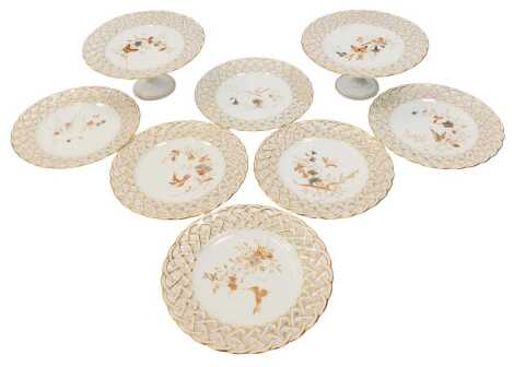 A late 19thC Continental porcelain part dessert service, comprising six plates and two tazza, each with a pierced border, decorated centrally with flowers, butterfly, etc., each 23cm diameter.