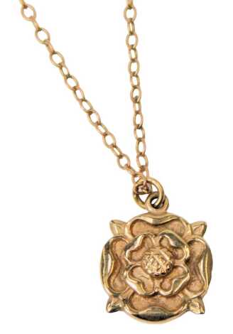 A 9ct gold Tudor rose pendant on an oval link neck chain, with bolt ring clasp, 3.4g.