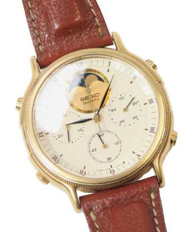 A Seiko gentleman's chronograph wristwatch, the circular cream dial bearing Roman numerals, centre seconds, three subsidiary dials, leather strap.