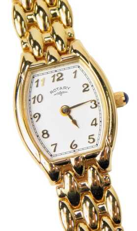 A Rotary lady's gold plated wristwatch, with an oblong dial bearing Arabic numerals, cabochon set winder, on an integral bracelet.