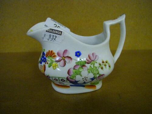 A Victorian London shape creamer with polychrome chinoiserie decoration