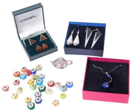 A Pia shaped pendant on chain, teapot brooch, earrings, pairs of silver and amber earrings, Pandora type beads. (a quantity)