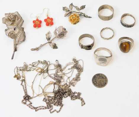 Silver and costume jewellery, including rose brooches, rings, and neck chains. (a quantity)