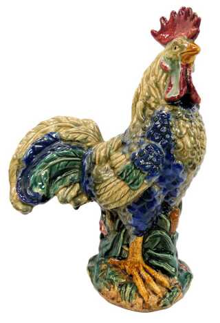 A pottery figure of a cockerel, indistinct signature to base, 42cm high.