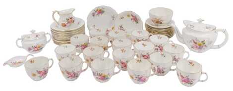 A Royal Crown Derby porcelain Derby Posies tea service, comprising a teapot, lidded twin-handled sugar bowl, strainer and bowl, jug, sugar bowl, eighteen teacups, twelve saucers, and fifteen side plates.