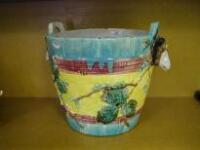 A Victorian majolica planter in the form of a coopered milk bucket with ram's head masks