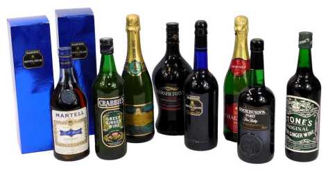 A group of alcohol, comprising three bottles of Harvey's Bristol Cream, Kirsberry, Stone's Green Ginger wine, sparkling wine, Cockburn's port, sparkling Perrier, Martel cognac, Crabbies Green ginger wine.