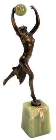 An Art Deco style figural statue, modelled as a female in flowing dress with arms raised holding an onyx ball, on a square tapering onyx base, unsigned, 36cm high.