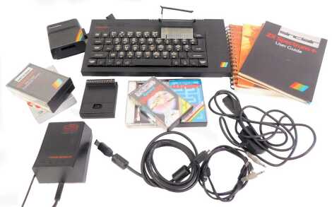 A Sinclair 2x Spectrum Plus keyboard, together with power supply, a ZX Micro Drive, various cassettes, user manual, etc. (a quantity)WARNING!  This lot contains untested or unsafe electrical items.  It is supplied for scrap or re-conditioning only TRADE O