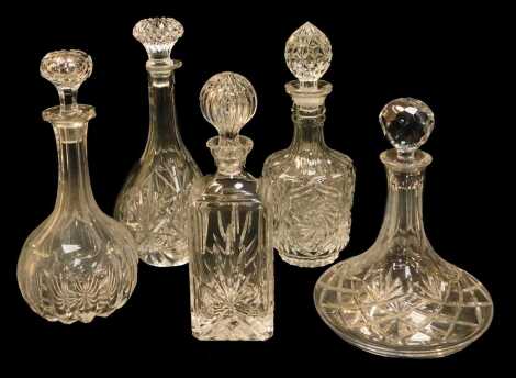 A group of cut glass and moulded decanters, to include a ship's decanter and stopper, 26cm high, square shaped decanter and stopper, 28cm high, etc. (5)