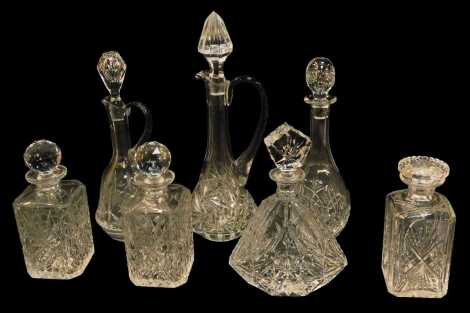 A group of cut and moulded glass decanters and claret jugs, to include a Laustzer glass claret jug and stopper, 36cm high, and a square shaped decanter and stopper, 23cm high, etc. (7)