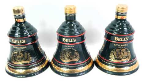 Three Bell's whisky Christmas decanters, comprising Christmas 1993, 1994 and 1995, each with contents.