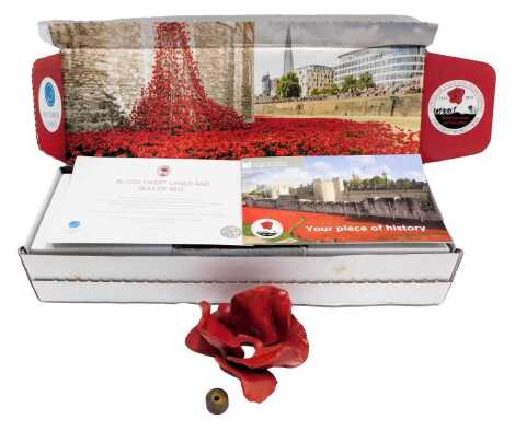 A Paul Cummins ceramic poppy, boxed with certificate.