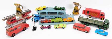 Various diecast vehicles, to include a Dinky Toys Robertson's Golden Shred van, car transporter with loading ramp, fire engine, various Matchbox cars, etc, and two miniature Wade jugs. (1 tray)