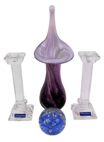 A pair of Villeroy and Boch glass candlesticks, 20cm high, together with a glass paperweight with internal blue bubble decoration, 7cm high, and an Alum Bay Isle of Wight purple glass vase, 33cm high.