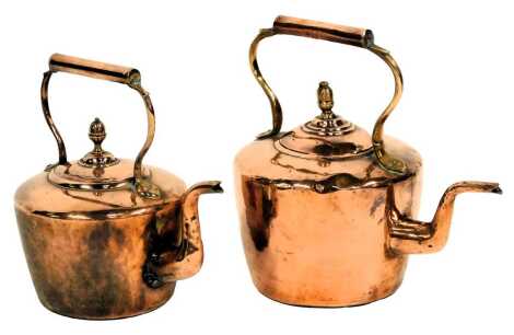 A Victorian brass kettle, 33cm high, and another, 31cm high.