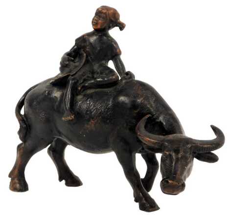 An early 20thC Chinese carved wooden figure group, of the boy on the buffalo, 17cm high. (AF)