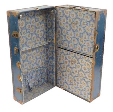 An early 20thC travelling trunk, in turquoise, 103cm wide.