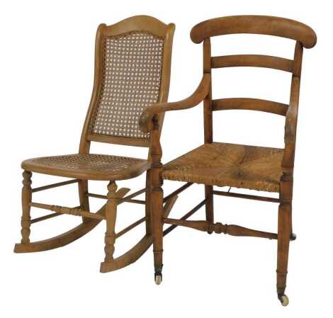 A 19thC beech country made chair, ladder back rush seat, on turned legs united by stretchers, on castors, together with a 20thC beech rocking chair, with caned seat and back.